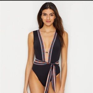 Kenneth Cole one piece swimsuit. Deep V cut.